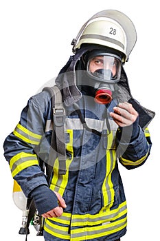 Young firefighter in uniform using protective breathing mask on his head