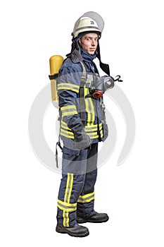 Young fireman with a mask and an air breathing apparatus on his back in a fully protective suit