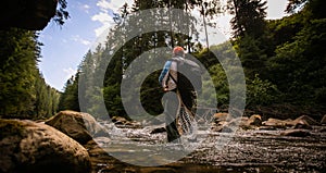 Young Fisherman catching on a river.