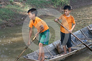 Young fishing boys are having pleasure in the Mekong river in Laos