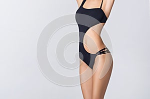 Young, fit and beautiful girl in sporty swimsuit. Sport, diet, health and beauty concept.