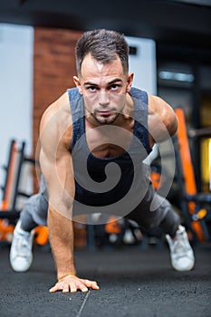 young fit caucasian male doing static exercise