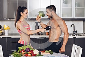 Young fit couple in the kitchen