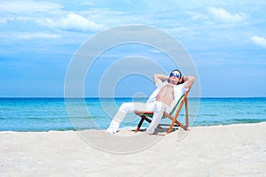 Young and fit man chilling on the beach