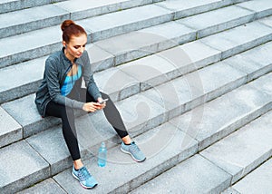 Young, fit and sporty brunette girl in sportswear. Woman doing sports outdoor.