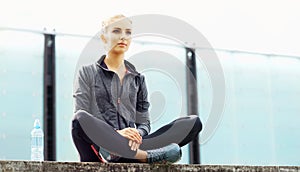 Young, fit and sporty brunette girl in sportswear. Woman doing sports outdoor.