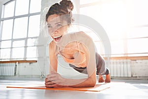 Young fit woman doing abs sports exercises