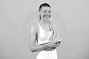 Young fit woman. Healthy lifestyle and sports concept. Isolated on gray.