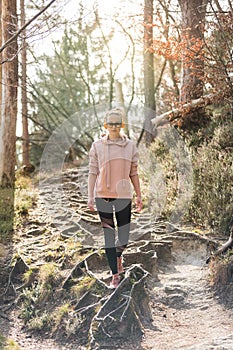 Young fit woman hiking in nature. Adventure, sport and exercise