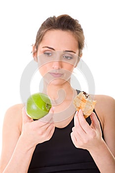 Young fit woman making decision what to eat