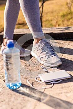 Young fit woman preparing for running