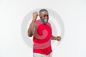 Young fitness african black man in sport wear cheering carefree and excited. Victory concept.