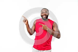 Young fitness african black man in sport wear cheering carefree isolated over white background.