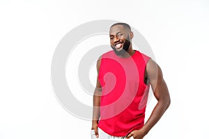 Young fitness african black man in sport wear cheering carefree isolated over white background.