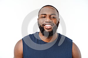 Young fitness african black man in sport wear cheering carefree isolated over white background.