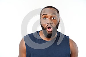 Young fitness african black man in sport wear cheering carefree isolated over white background.