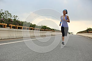 Young fitness asian woman runner running