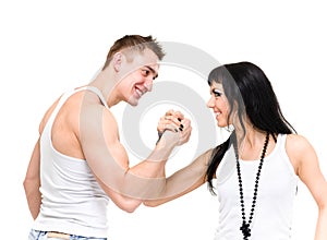 Young fitness couple wearing jeans in the studio