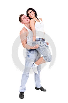 Young fitness couple wearing jeans in the studio