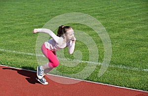 Young fitness female runner legs ready for run. Young fitness woman runner running. Child playing on outdoor playground