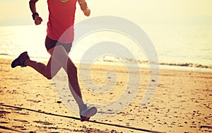 female runner running at beach