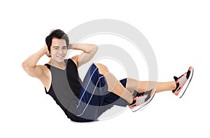 Young fitness man making stretching exercises