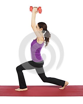 Young fitness woman doing lunge with weights