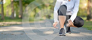 Young fitness woman legs walking in the park outdoor, female runner running on the road outside, asian athlete jogging and exercis
