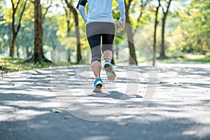 Young fitness woman legs walking in the park outdoor, female runner running on the road outside, asian athlete jogging and exercis