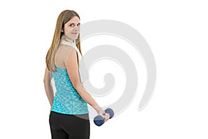 Young fitness woman lifting dumbbell