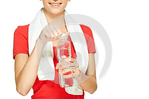 Young fitness woman opening bottle of water