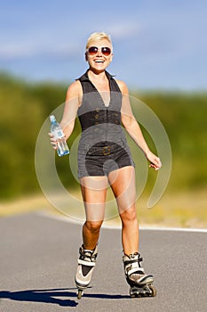 Young fitness woman on rollers
