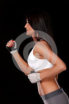 Young fitness woman run, side view