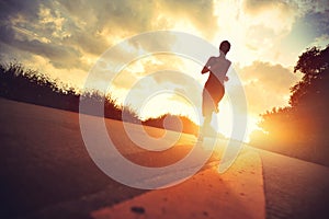 Young fitness woman runner running