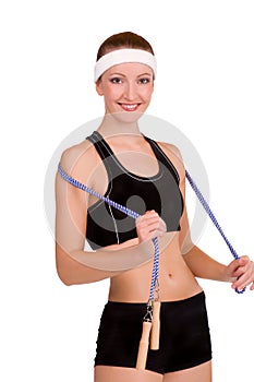 Young fitness woman with skipping rope