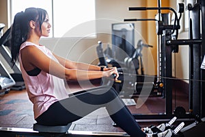 Young fitness woman working out in the gym