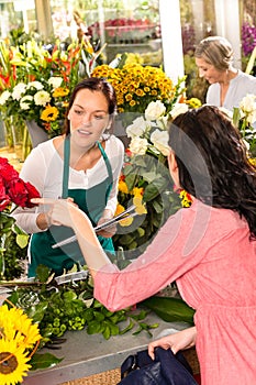 Young florist ordering roses woman customer flower