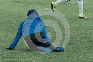 A young football player boy was injured in the game