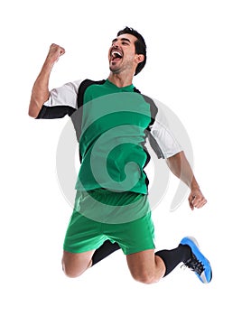 Young football player celebrating scoring of goal on white
