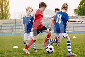 Young Football Players Kicking Ball on Soccer Field. Soccer Horizontal Background