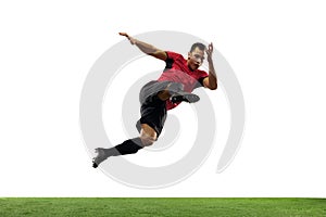 Young football, soccer player of team in action, motion isolated on white background. Concept of sport, movement, energy