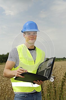 Young foreman with blue helmet