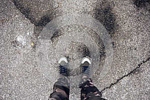 Young free adventurous man standing on the street