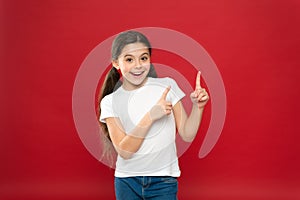 Young and free. Happy child girl with long hair on red background. Happiness and joy. Positive emotions. Child care and