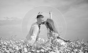 Young and free. romantic relationship. beautiful couple in love. man and woman in chamomile flower field. summer