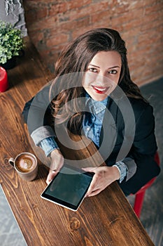 Young freelancer girl is working hard in laptop