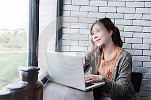 Young Freelancer Woman Working on Computer Laptop in Cozy House, Female in Thoughtful Posture Looking Outside Window