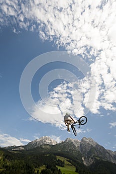 Young freestyler jumps with his bmx high into air