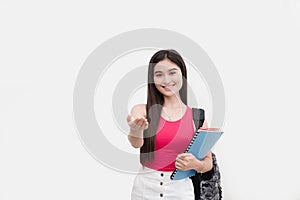 A young friendly freshman student introduces herself on the 1st day of class. Portrait isolated on a white backdrop