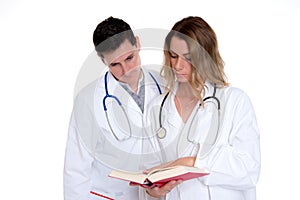 Young friendly medical team with book in lab coat